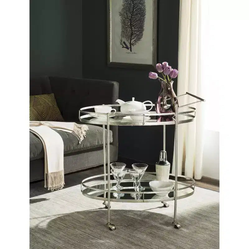 Chariot de bar élégant avec étagères en verre miroir et cadre en fer argenté